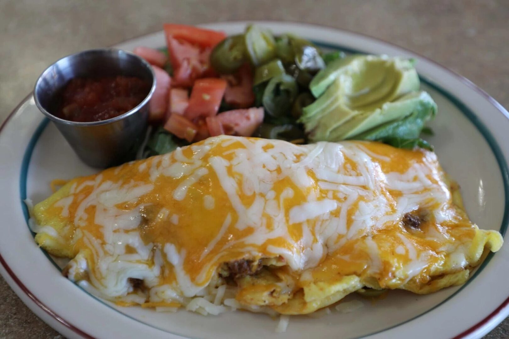 A plate of food with cheese and meat on it.